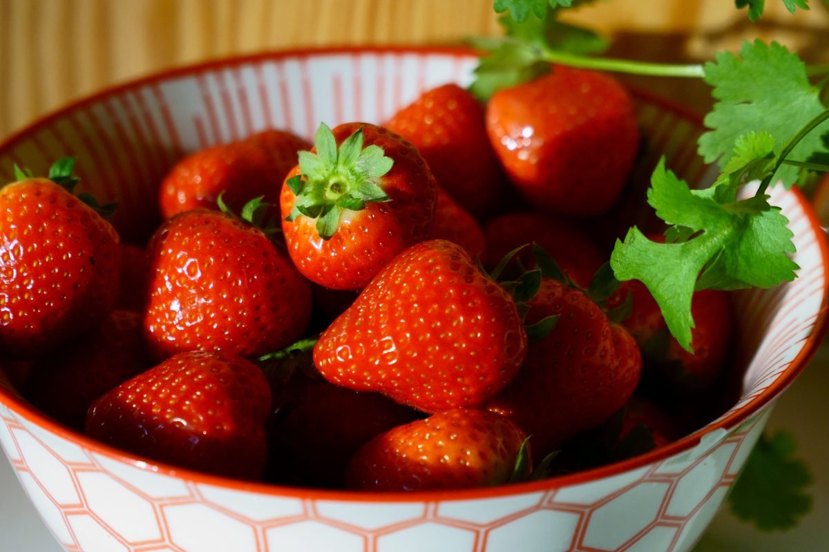 A bowl of fresh whole strawberries