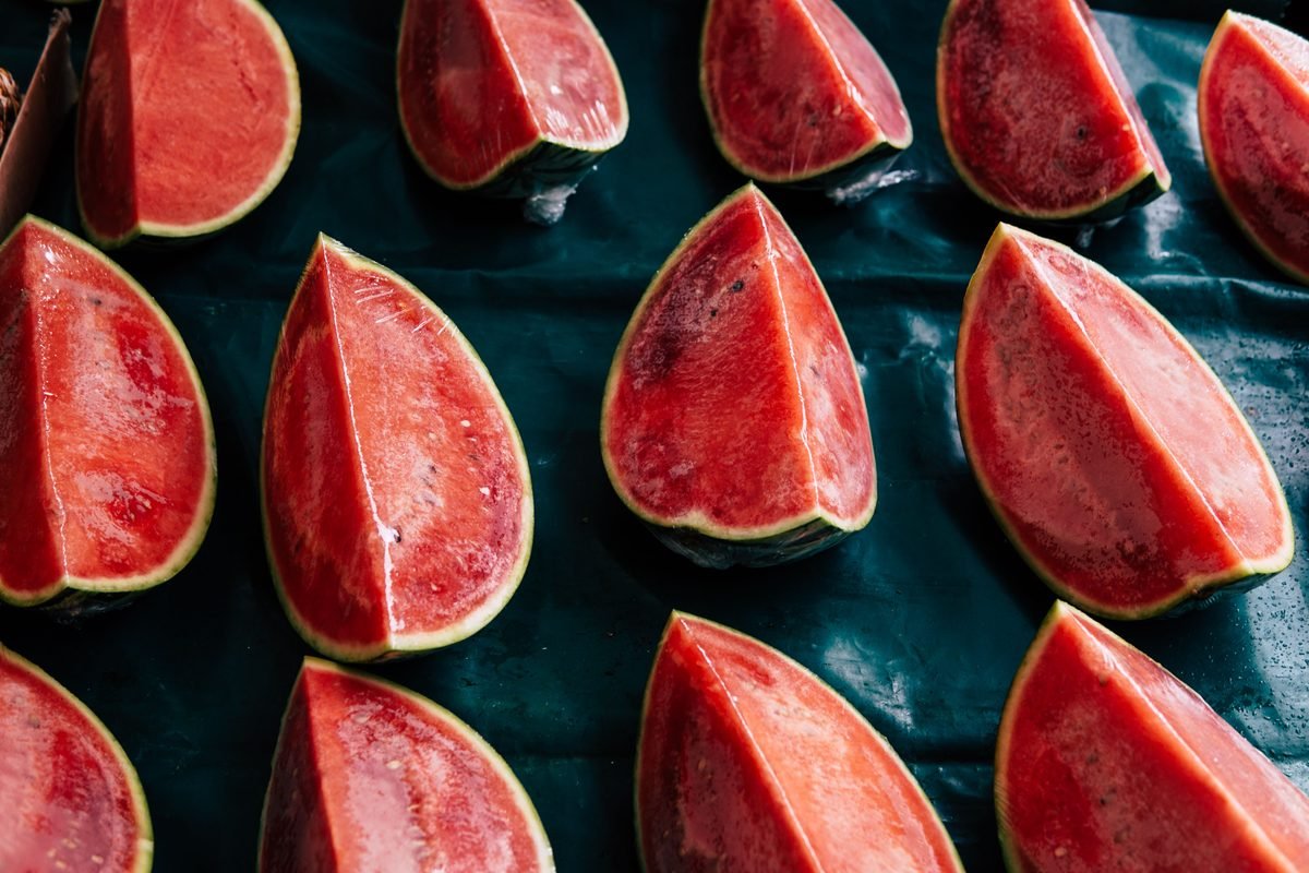 Slices of watermelon arranged in rows